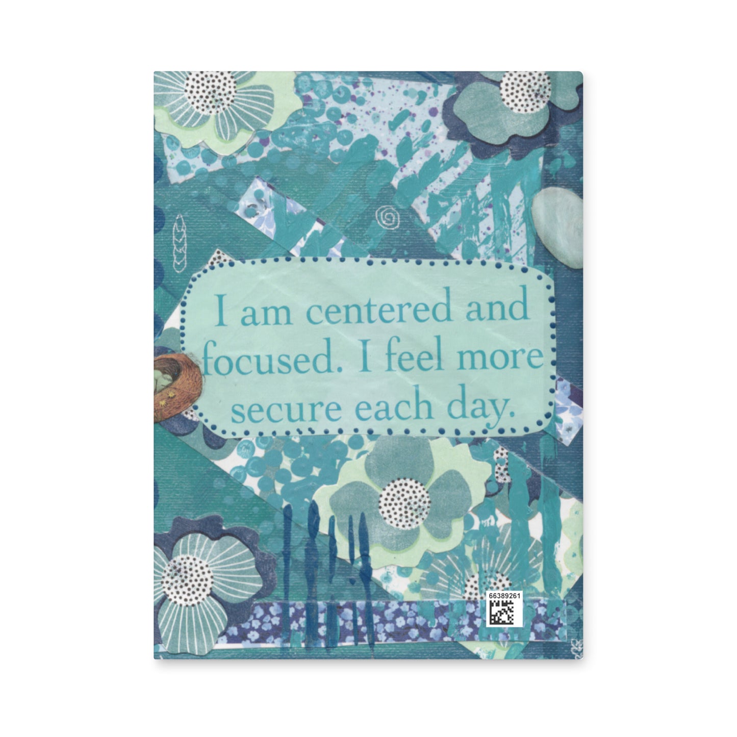 The back cover of a blue floral hardcover journal  with the same image, flowers with a blue text box in middle that says "I am centered and focused. I feel more secure each day".