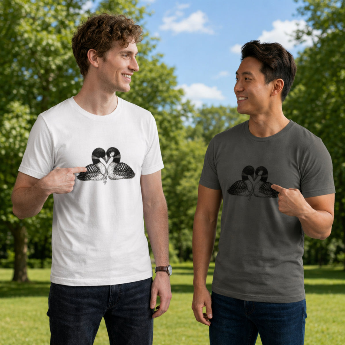 Two men wearing t-shirts with a graphic design of two loons in a heart shape. The men are outdoors on a sunny day.