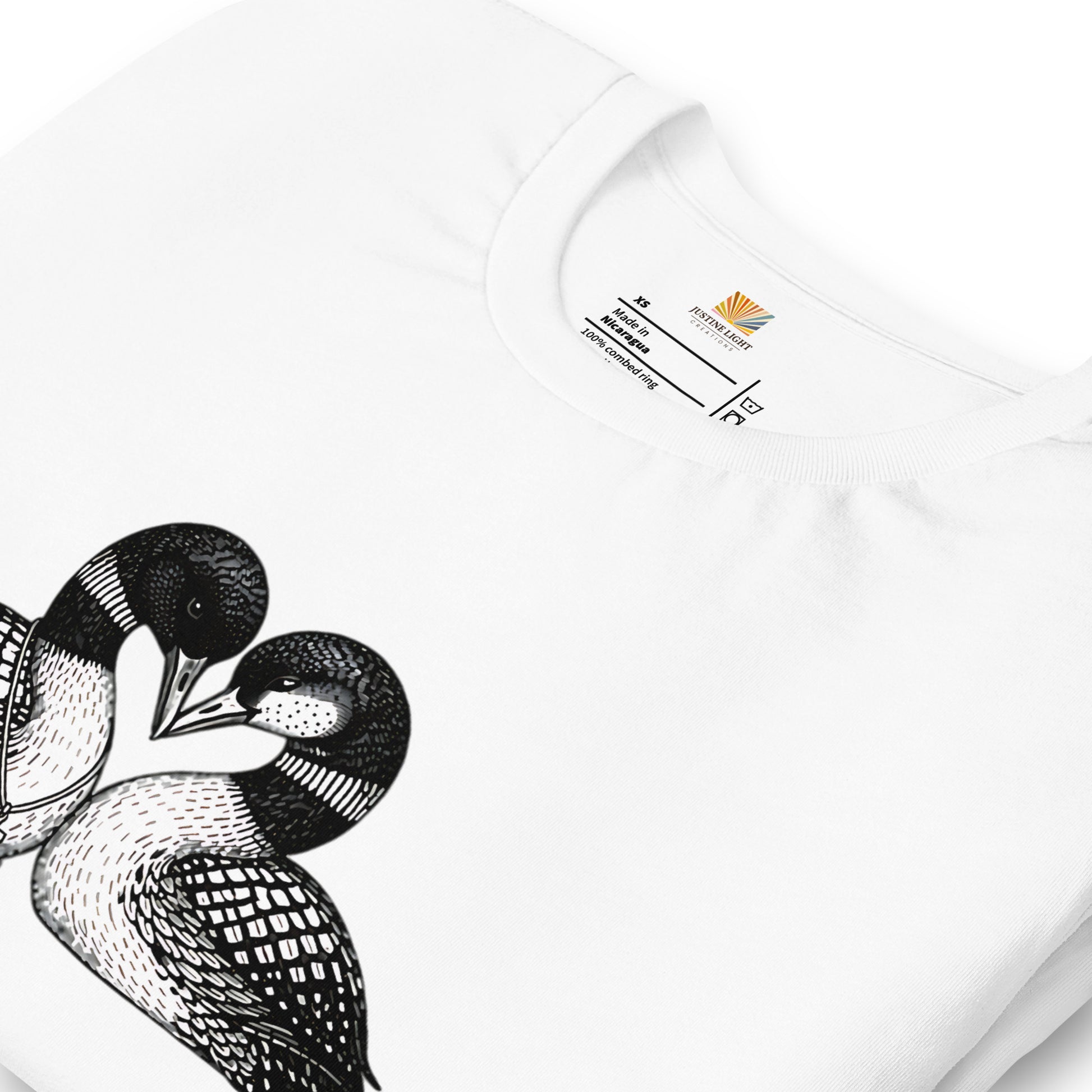 close view of crew style collar on hockey romance loon t-shirt, showing inside label. White colored shirt