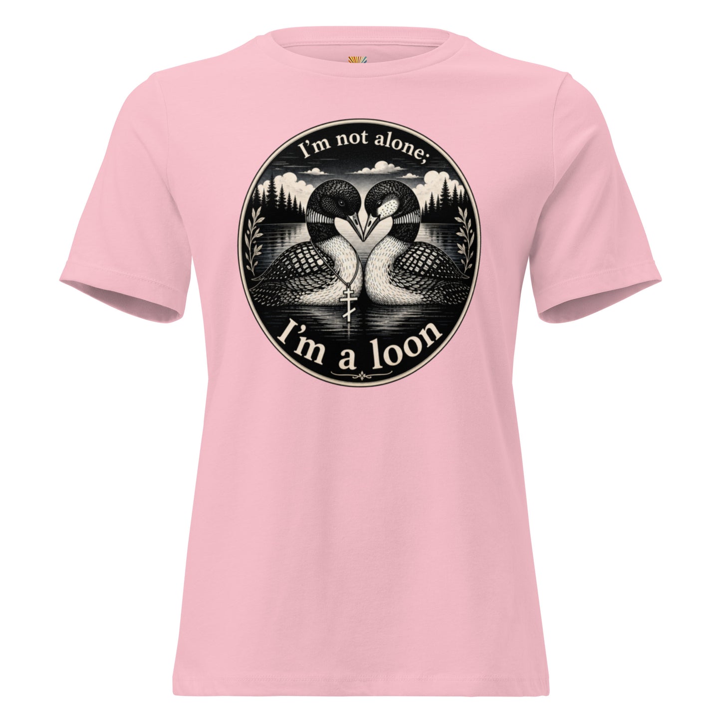 A graphic tee for women in pink, short-sleeved crewneck featuring a circular black and white graphic print of two loons facing each other, with the text 'I'm not alone; I'm a loon' arched above and below the illustration.